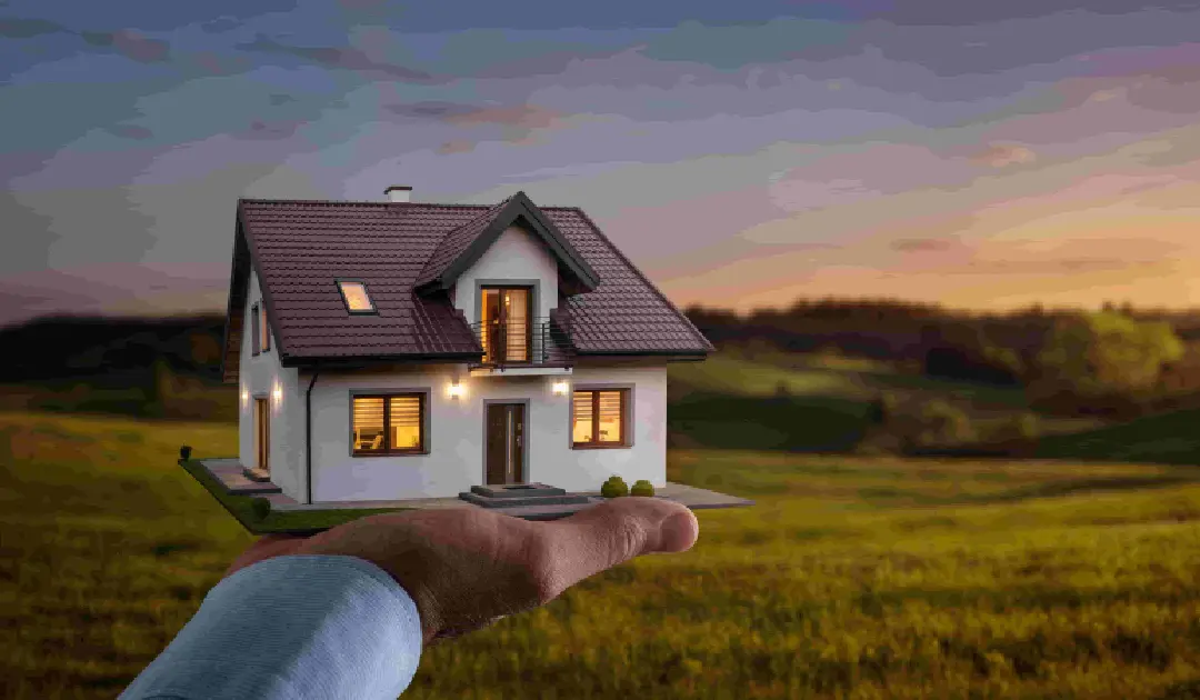 A Home Buyer in Utah holding a small model house with lit windows, set against a scenic countryside landscape at sunset