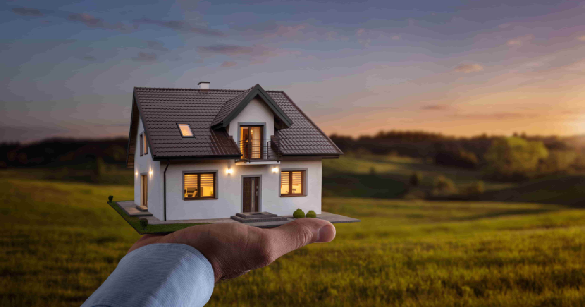 A Home Buyer in Utah holding a small model house with lit windows, set against a scenic countryside landscape at sunset